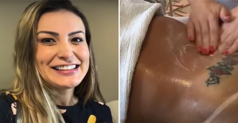 Andressa Urach exibe marquinha de biquini fio dental durante sessao de massagem